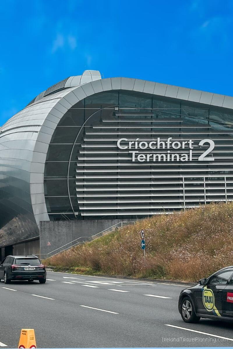 Dublin Airport Terminal 2 (Criochfort 2) with cars and blue sky