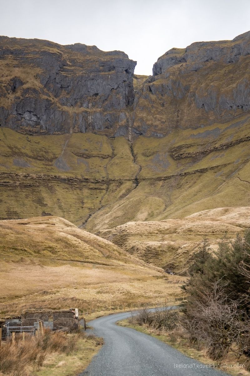 Scenic Irish road leading to a dramatic mountain valley