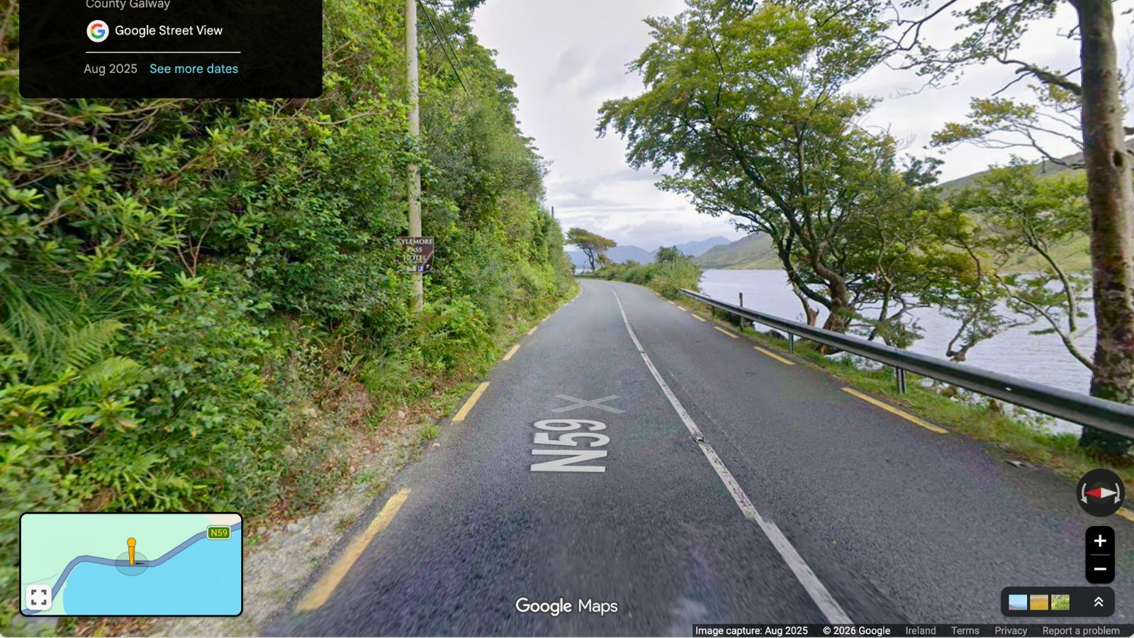 N59X road in County Galway, Ireland, with a lake and trees