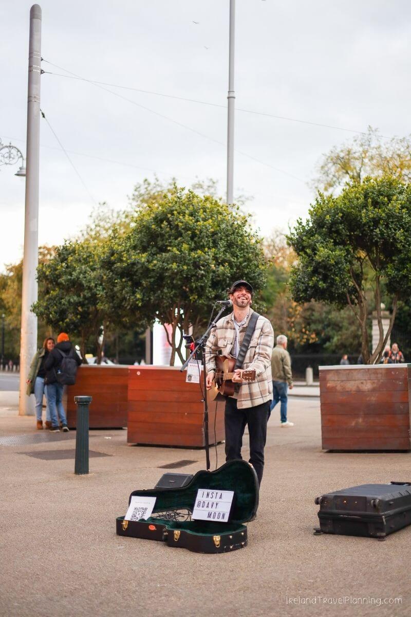 Street musician "Heavy Moon" plays guitar in Dublin, Ireland.