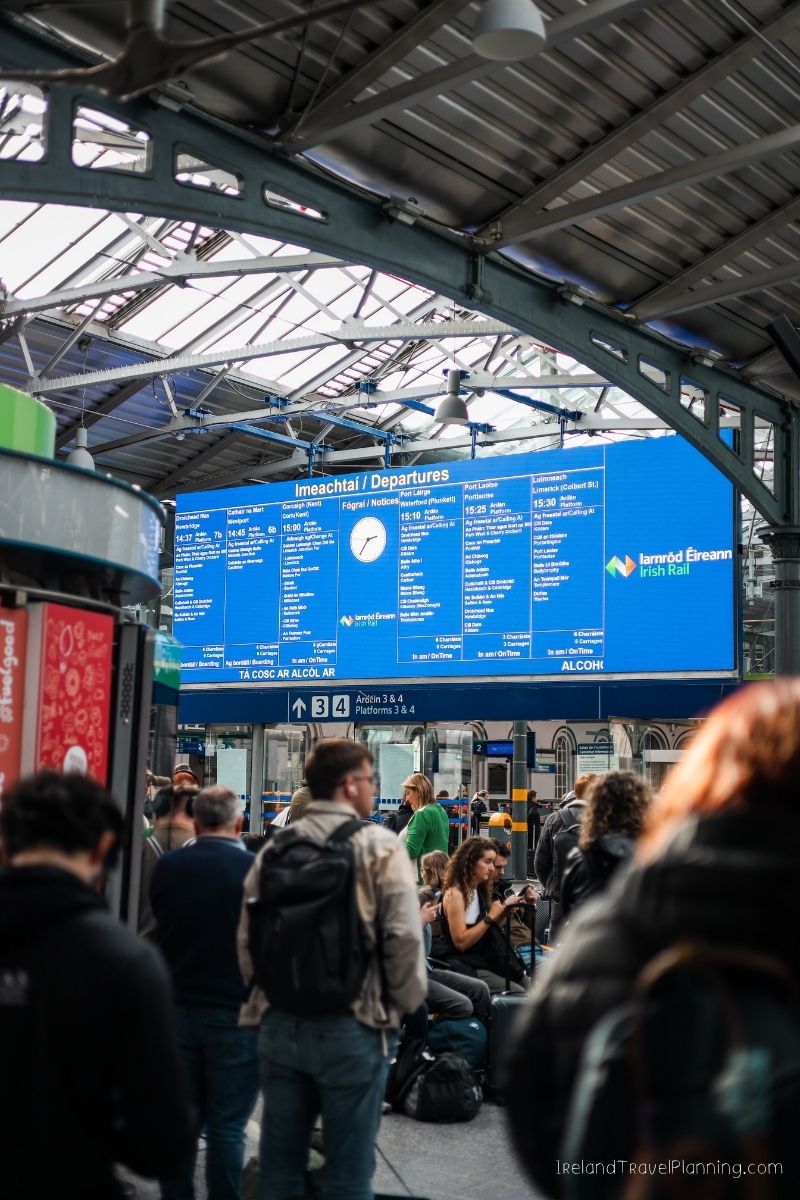 Iarnród Éireann departures board at a busy Irish train station