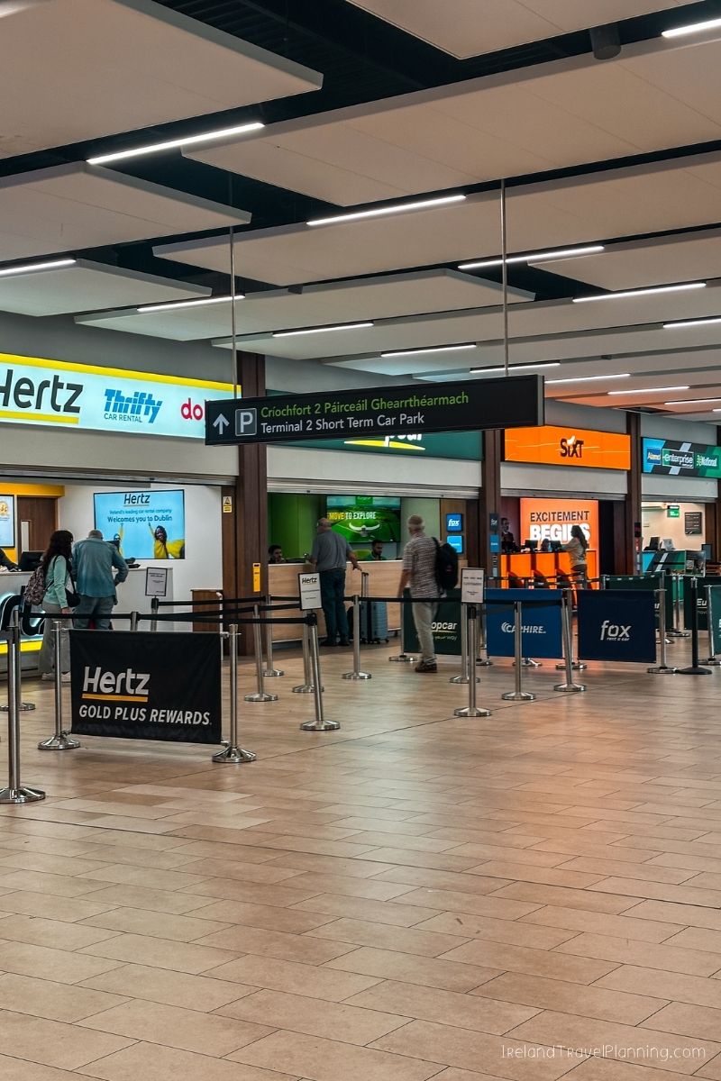 Car rental desks at Dublin Airport, including Hertz and SIXT, for Ireland travel.
