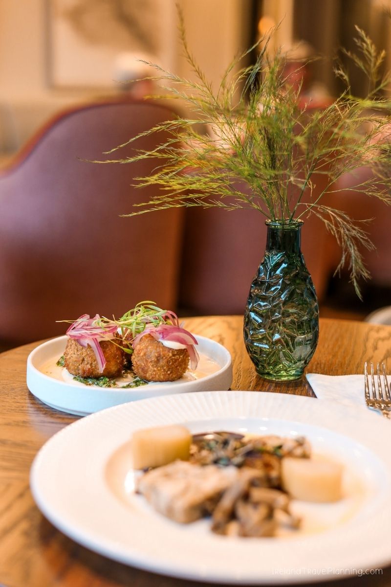 Gourmet Irish food: croquettes and main dish with asparagus centerpiece