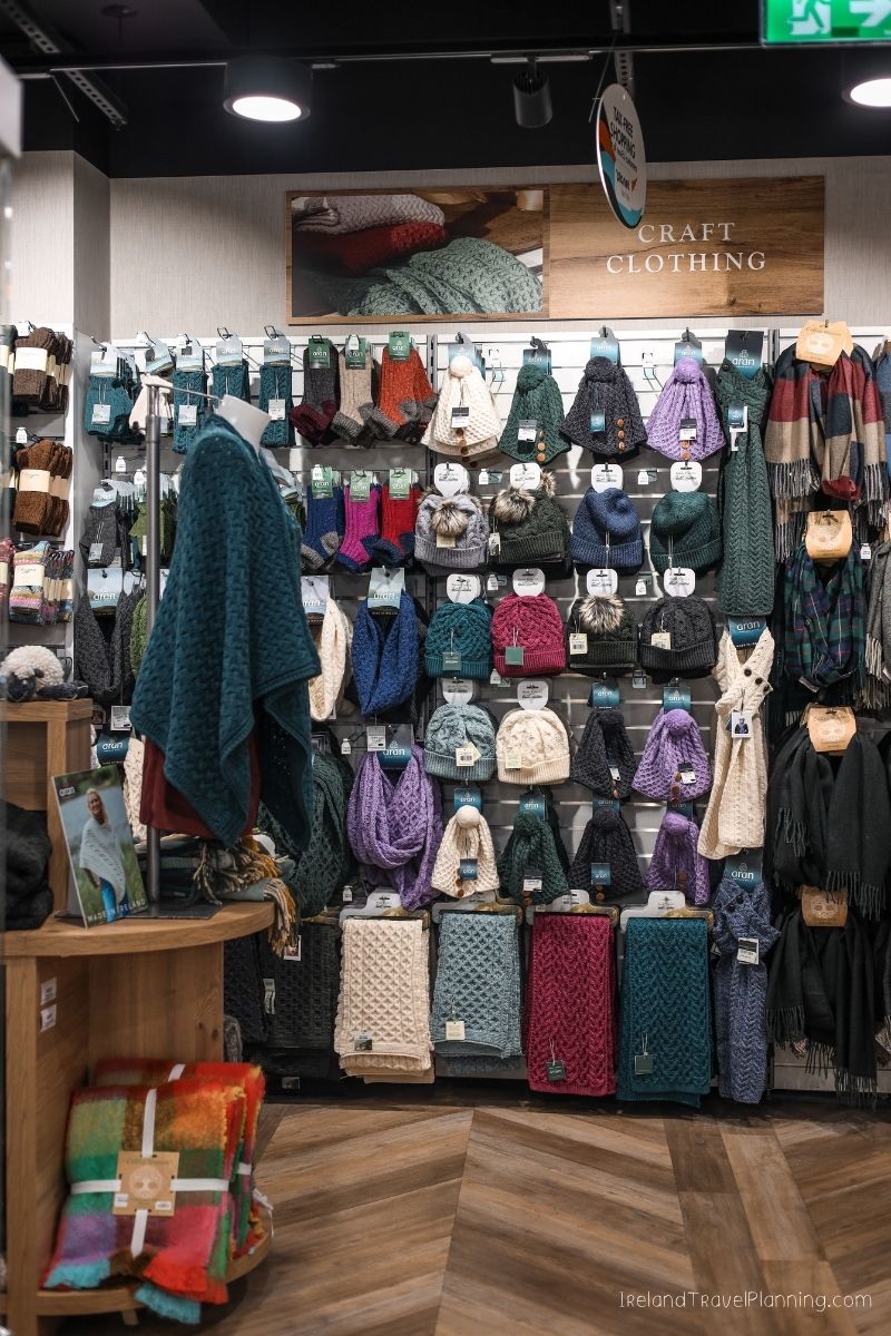 Irish wool clothing shop display with sweaters, scarves, and hats