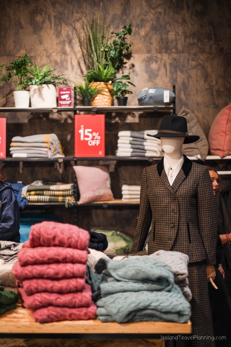 Mannequin in tweed suit and hat in Irish shop, 15% off sale
