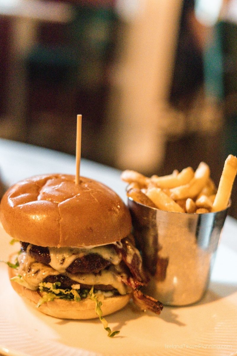 Double bacon cheeseburger with fries, a popular meal in Ireland.