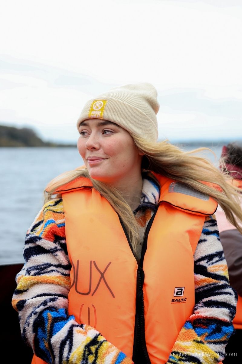Woman in life vest on boat trip in Ireland