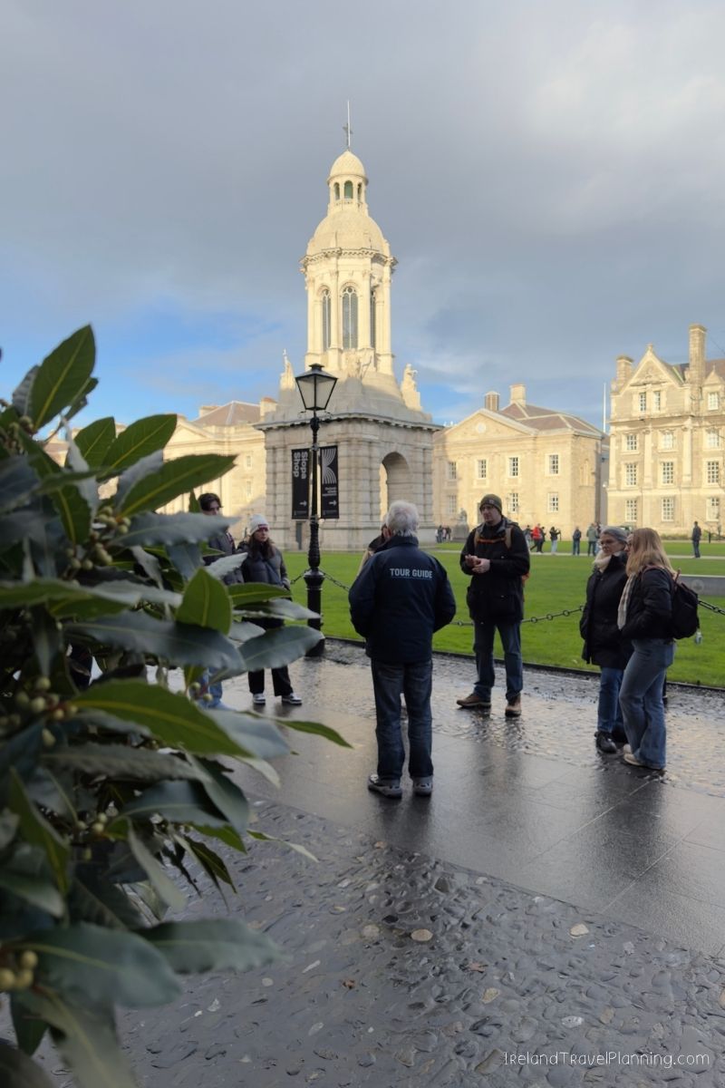 Tour guide leads group at Trinity College Dublin, Ireland