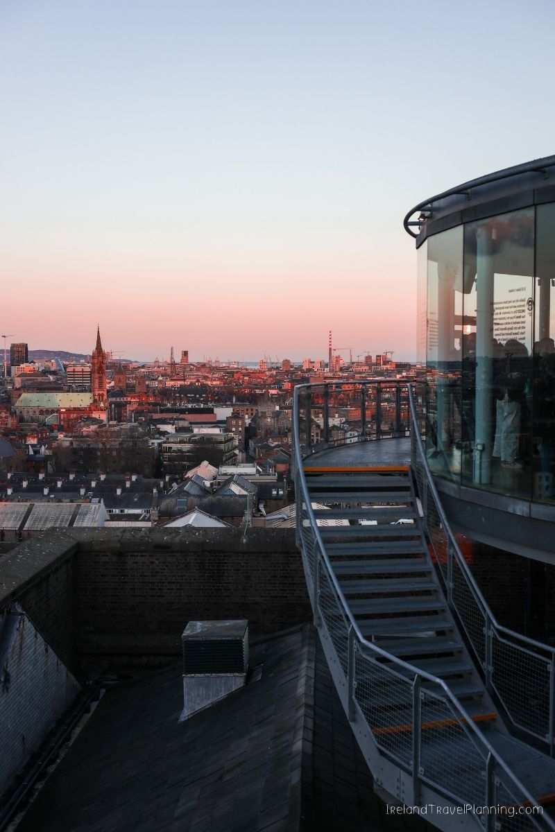 Sunset over Dublin cityscape from a rooftop cafe, Ireland travel.