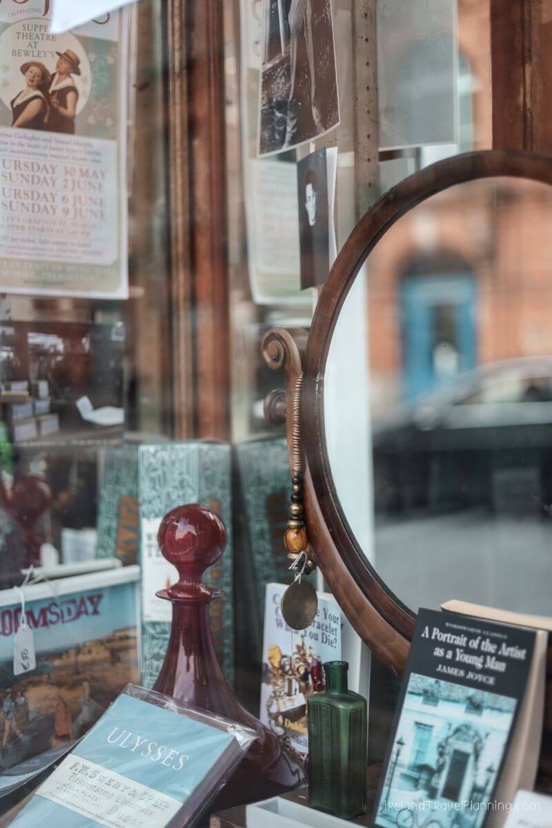 Ulysses book and theatre posters reflected in a mirror, Dublin