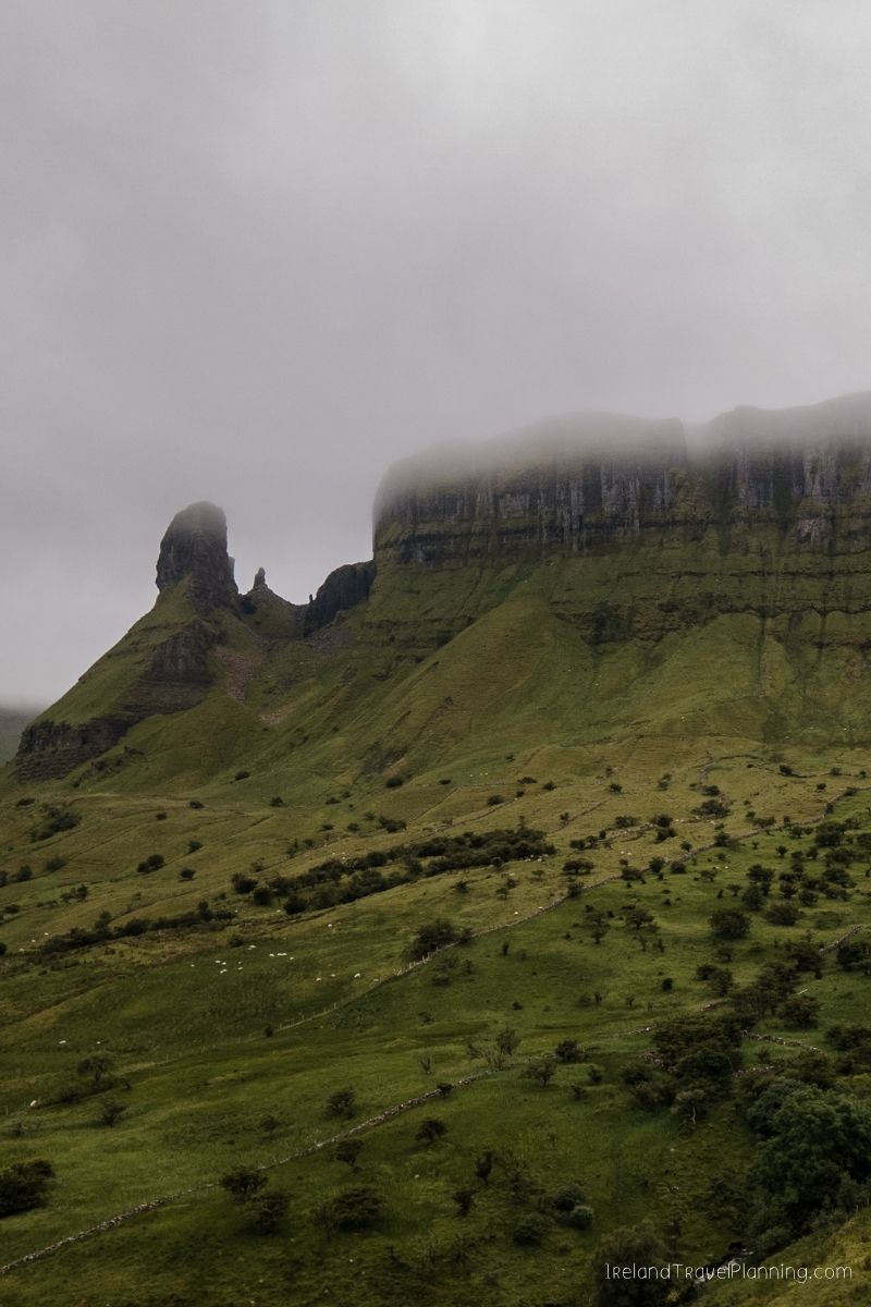 Misty Benbulben mountain in County Sligo, Ireland, with green slopes.