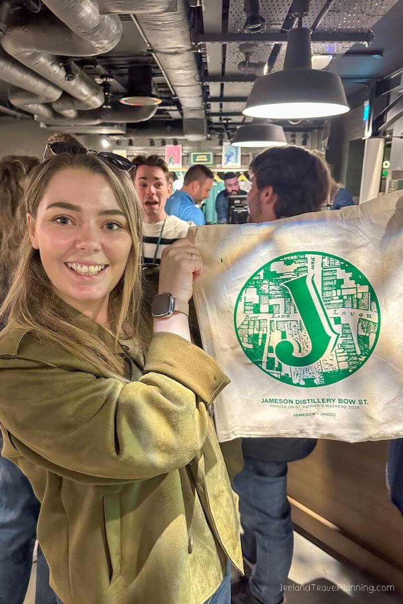 Woman at Jameson Distillery Bow St. with St. Patrick's Weekend 2023 tote