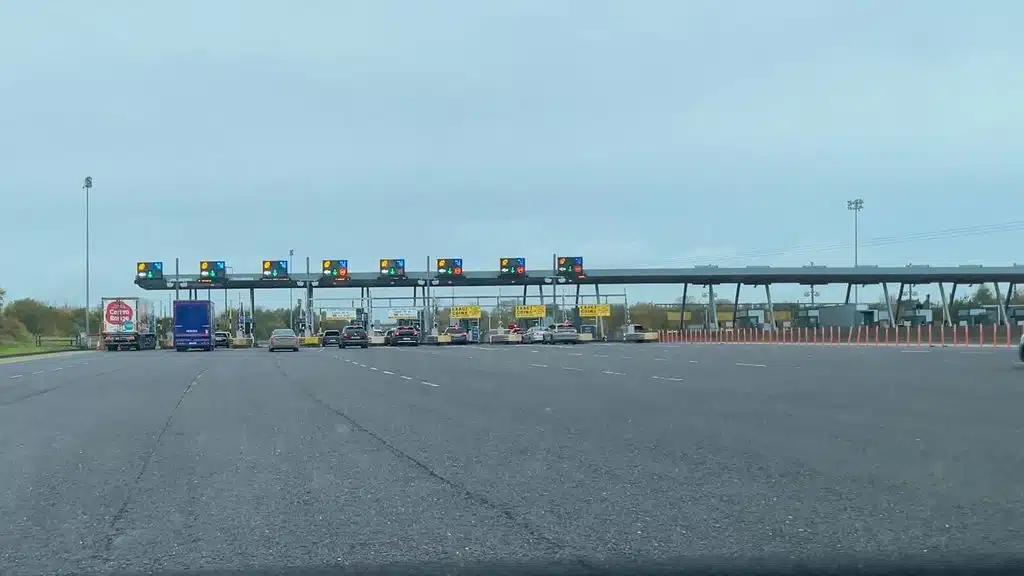 Cars at an Irish toll plaza on a cloudy day
